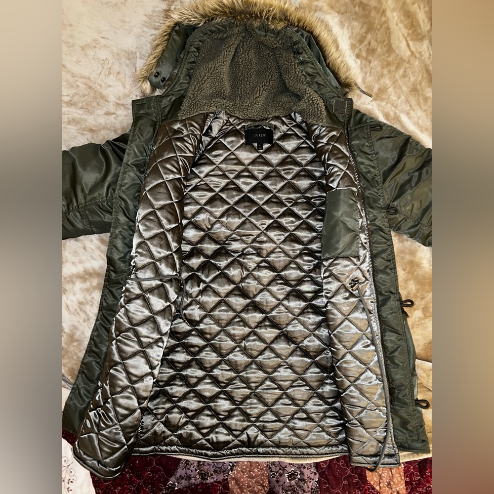 This is a dark olive green J. Crew coat in size Large.